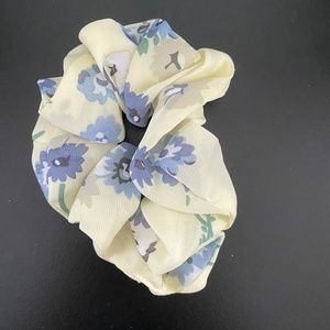 yellow scrunchie w/ blue flowers and green stems